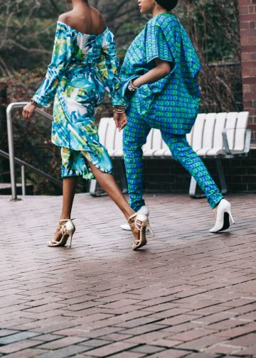 two women in teal romper pants