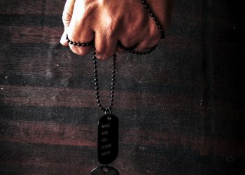 person holding black samsung remote control