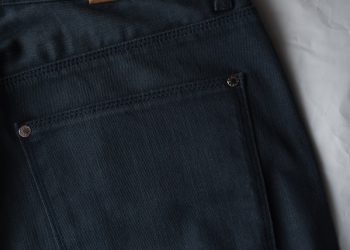 black denim bottoms on white textile