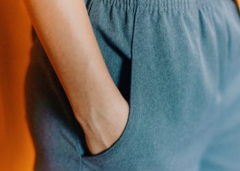 closeup photo of person hiding his right hand in his pocket