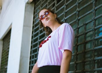 woman standing in front of gate