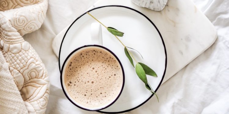 white teacup filled with coffee