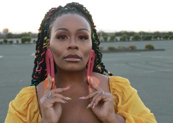 a woman holding her hands up