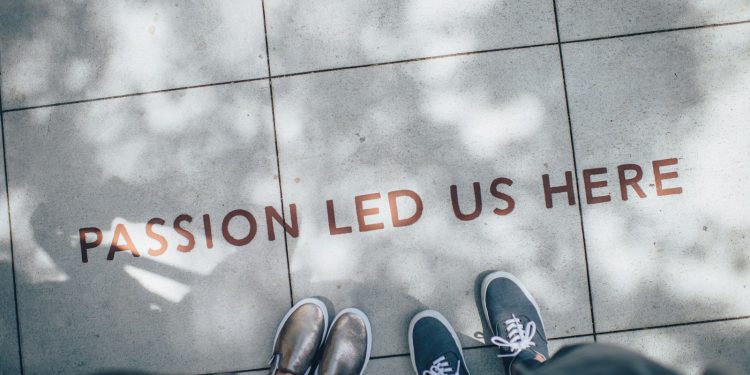 two person standing on gray tile paving