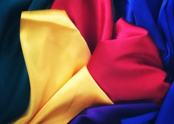 photo of red, yellow, blue and green silk cloths