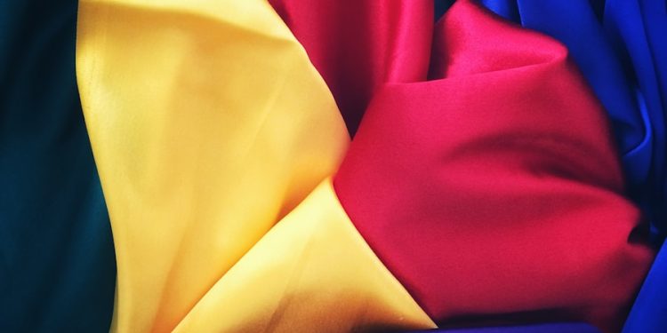 photo of red, yellow, blue and green silk cloths