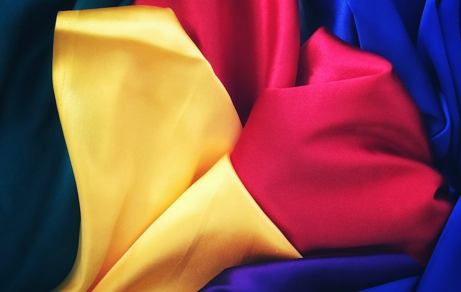 photo of red, yellow, blue and green silk cloths
