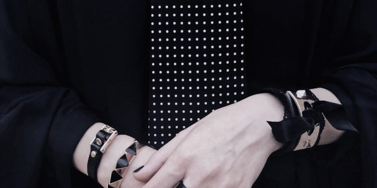 a person holding a tie